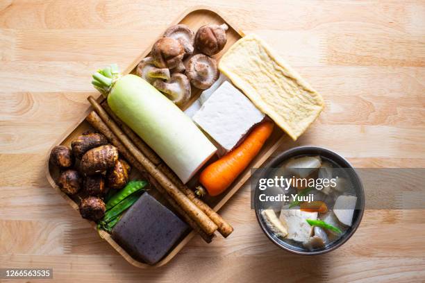 japanese local cuisine. soup dish in japanese (kentinjiru) recipe. - greater burdock stock pictures, royalty-free photos & images