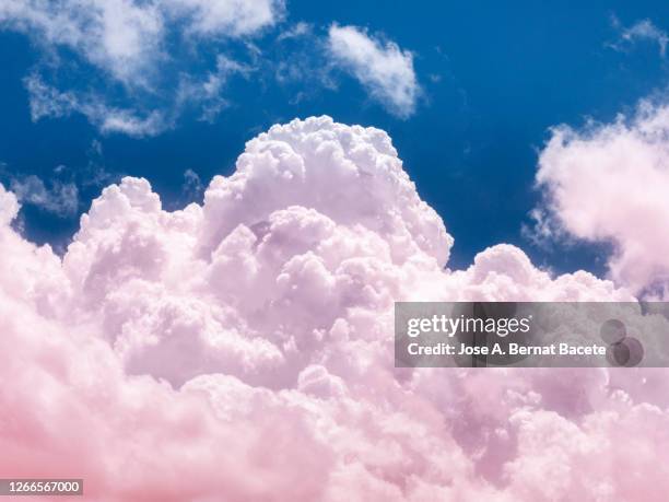 full frame of pink and blue sky with storm clouds. - cumulus stockfoto's en -beelden