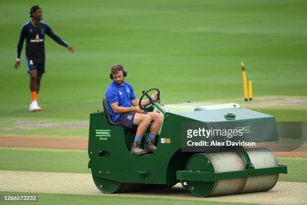 Member of the groundstaff rolls the pitch prior to Day 2 of The Bob Willis Trophy match between Sussex and Essex at The 1st Central County Ground on...