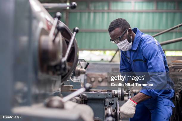 african american lathe worker working with milling machine in metal industry. - black glove stock pictures, royalty-free photos & images