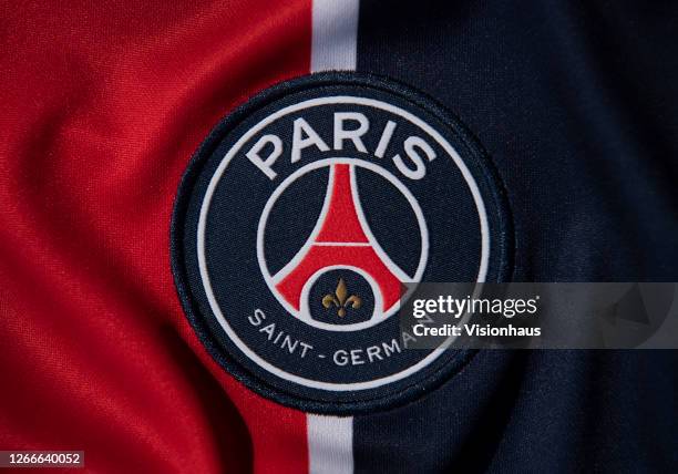 The Paris Saint-Germain club crest on their Nike first team home shirt on August 14, 2020 in Manchester, United Kingdom.