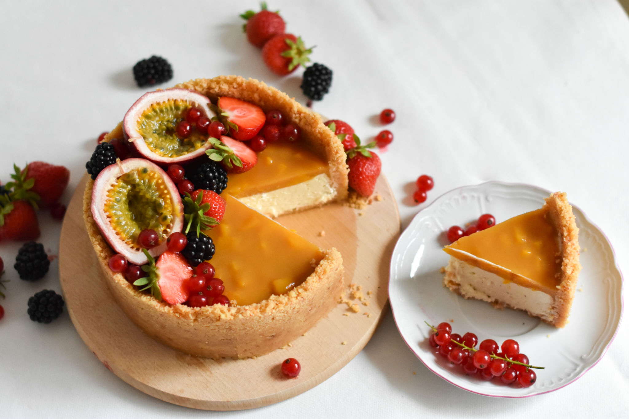 Cheescake New York with tropical fruit compote and fresh berry decoration Cheescake New York with tropical fruit compote and fresh berry decoration