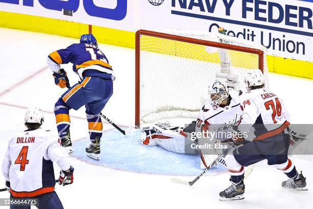 Mathew Barzal of the New York Islanders celebrates scores the game winning goal at 4:28 past Braden Holtby of the Washington Capitals during the...