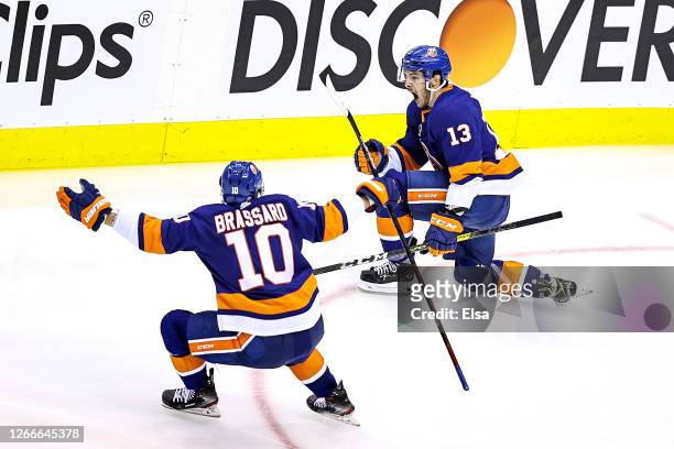Mathew Barzal of the New York Islanders celebrates with Derick Brassard after scoring the game winning goal at 4:28 against the Washington Capitals...