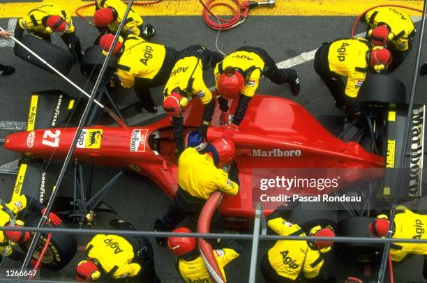 Aerial view of Jean Alesi of France in his Fiat Ferrari at a pit stop during the Brazilian Grand Prix at the Interlagos circuit in Sao Paulo, Brazil....