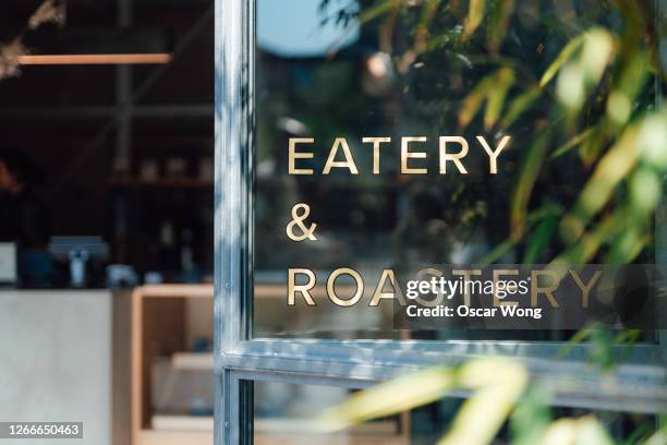 close-up of the door of a cafe - glass entrance imagens e fotografias de stock