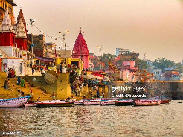 ganges river a sunset and varanasi city in the horizon - varanasi panorama stock pictures, royalty-free photos & images