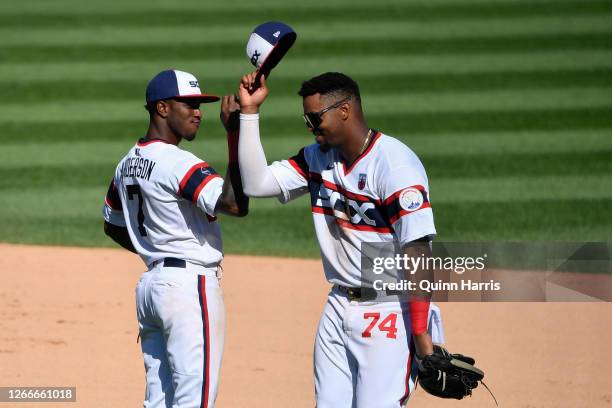 Tim Anderson and Eloy Jimenez of the Chicago White Sox celebrate the team win against the St. Louis Cardinals at Guaranteed Rate Field on August 16,...