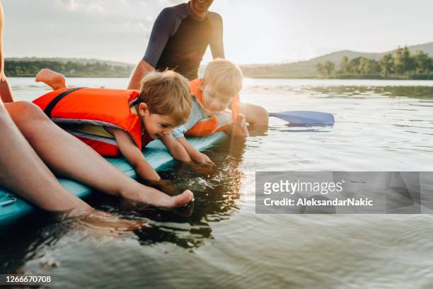 little paddlers - lake stock pictures, royalty-free photos & images