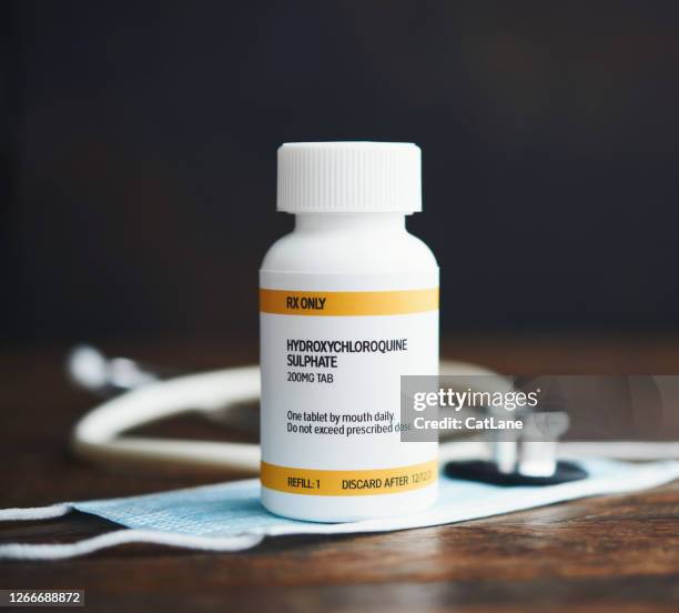 藥丸瓶中處方藥的聽診器和面罩:羥基氯奎磷酸鹽。 - chloroquine 個照片及圖片檔