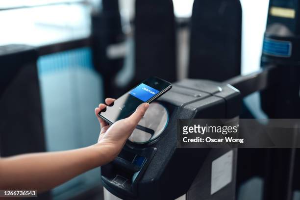 close-up of mobile contactless payment - contactless payment stock pictures, royalty-free photos & images