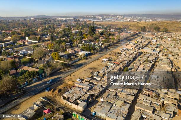 aerial view of inequality. kya sands informal settlement in johannesburg, south africa - gauteng province stock pictures, royalty-free photos & images