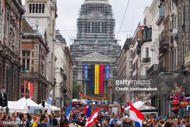 huge crowd in street rue de la regence in brussels at national holiday - national holiday stock pictures, royalty-free photos & images