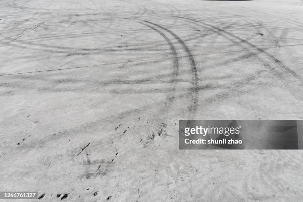 cement road covered with tire tracks - skid marks stock pictures, royalty-free photos & images