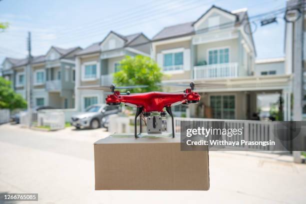 drone parcel delivery - drone parcel stock pictures, royalty-free photos & images