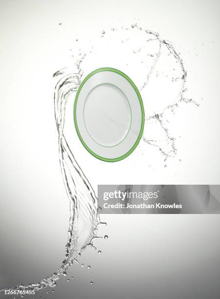 dinner plate in water - wash the dishes stock pictures, royalty-free photos & images