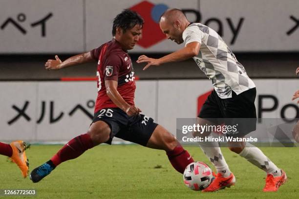 Yasushi Endo of Kashima Antlers and Andres Iniesta of Vissel Kobe compete for the ball during the J.League Meiji Yasuda J1 match between Kashima...