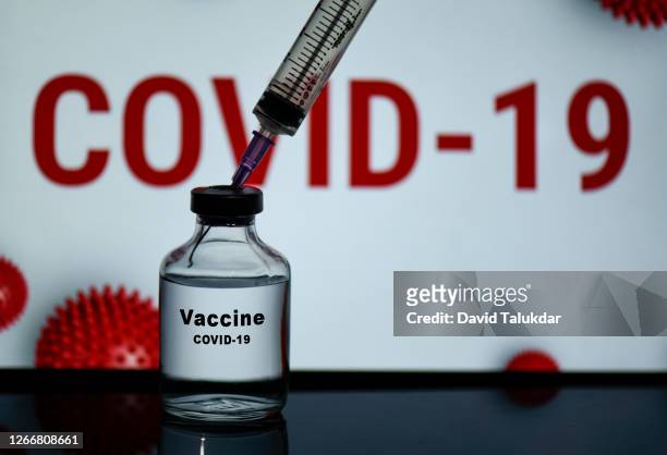 a bottle of  covid-19 vaccine - covid 19 stock pictures, royalty-free photos & images