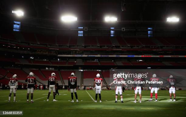 The Arizona Cardinals warm-up during a NFL team training camp at University of State Farm Stadium on August 17, 2020 in Glendale, Arizona.