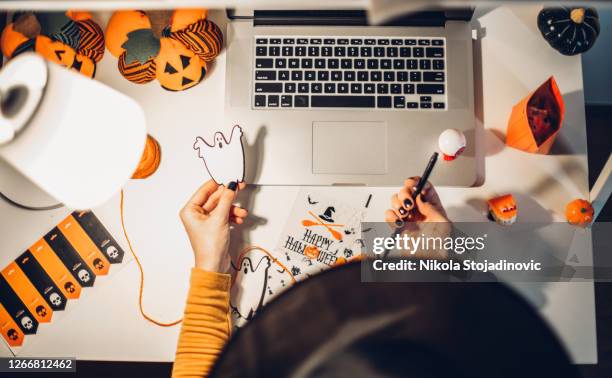 laptop and halloween preparation - halloween craft stock pictures, royalty-free photos & images