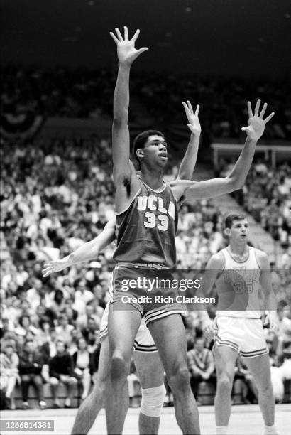 Lew Alcindor of the UCLA Bruins looks for a pass against UCLA's varsity team in the Freshman and Varsity team scrimmage on November 27, 1965 at...