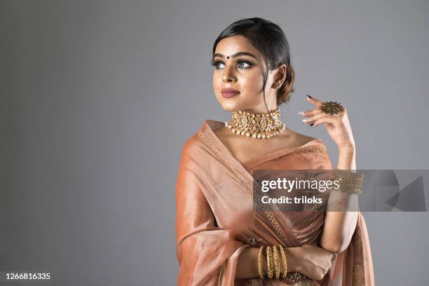 beautiful indian woman in sari - indian jewellery stock pictures, royalty-free photos & images