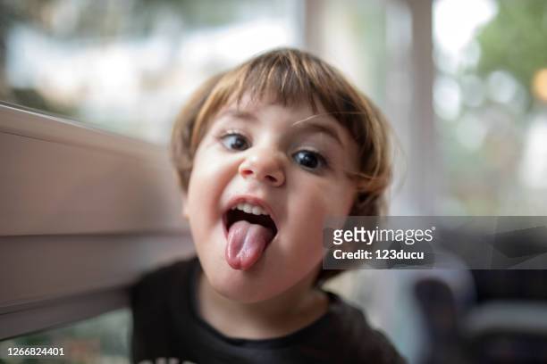 happy little boy - sticking out tongue stock pictures, royalty-free photos & images