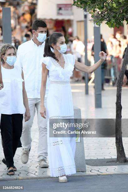 Queen Letizia of Spain is seen visiting the town of Sant Antoni de Portmany , tour of the promenade and streets of the second most populated...