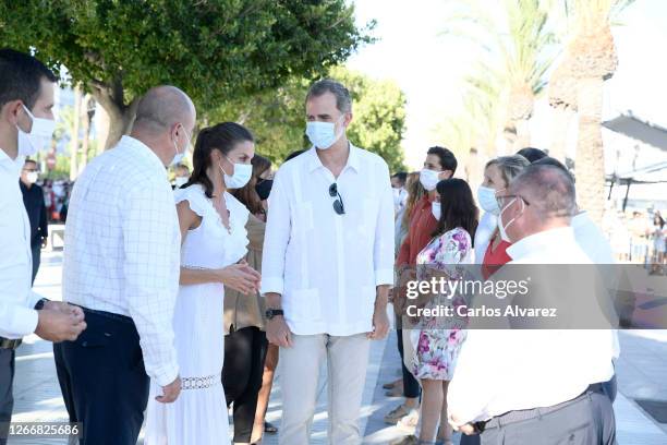 Queen Letizia of Spain and King Felipe of Spain are seen visiting the town of Sant Antoni de Portmany , tour of the promenade and streets of the...