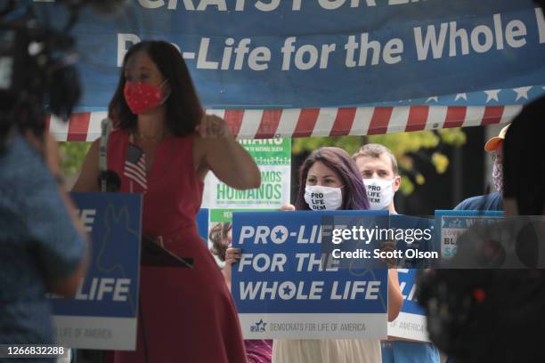 Small group of demonstrators from Democrats for Life America, protest in Zeidler Union Square near the Wisconsin center where the Democratic National...