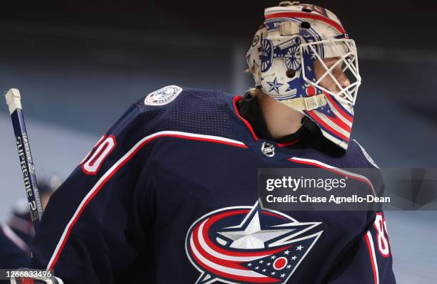 Goaltender Matiss Kivlenieks of the Columbus Blue Jackets attends warm ups before Game Four of the Eastern Conference First Round during the 2020 NHL...