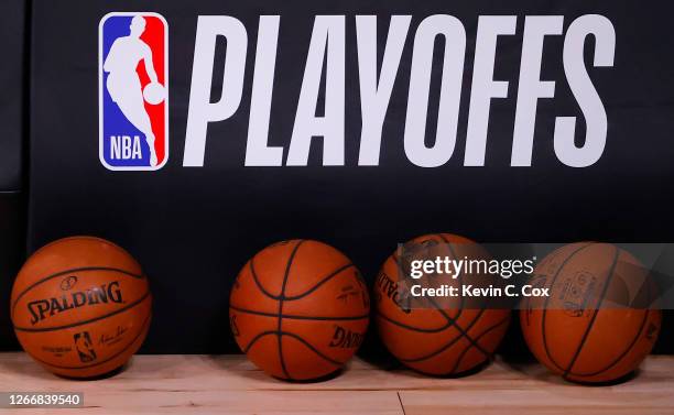 Basketballs are lined up under the NBA Playoffs logo before the start of a game between the Toronto Raptors and the Brooklyn Nets in Game One of the...