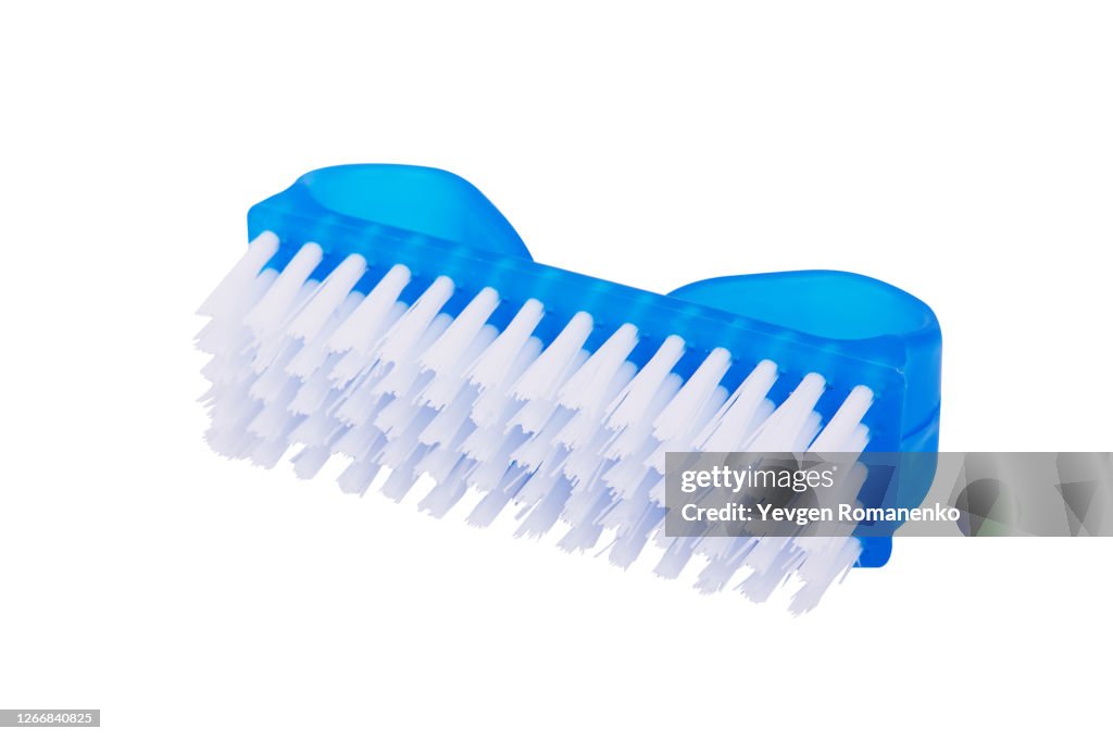 Plastic nail brush on a white background