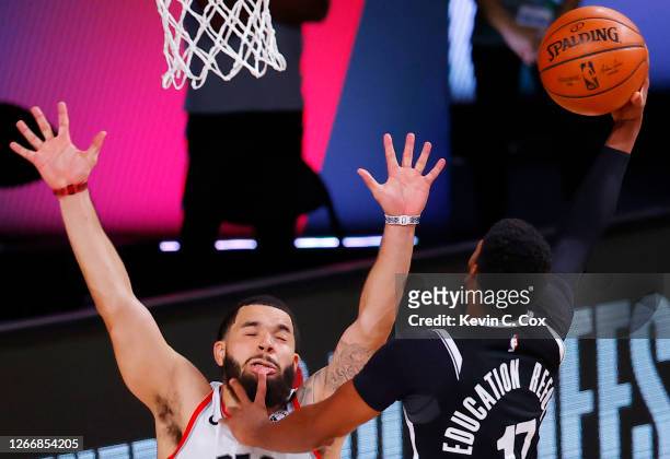 Garrett Temple of the Brooklyn Nets goes up for a shot against Fred VanVleet of the Toronto Raptors during the third quarter in Game One of the...