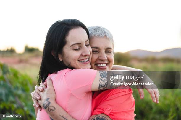 loving embrace of mother and daughter - empathy concept stock pictures, royalty-free photos & images