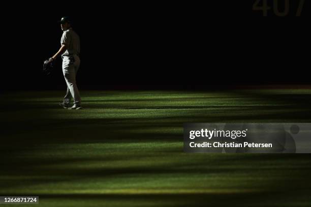 Outfielder Ramon Laureano of the Oakland Athletics warms-up before the MLB game against the Arizona Diamondbacks at Chase Field on August 17, 2020 in...