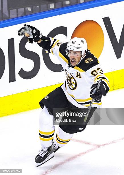 Brad Marchand of the Boston Bruins celebrates after scoring the go-ahead goal at 11:40 against the Carolina Hurricanes during the third period in...