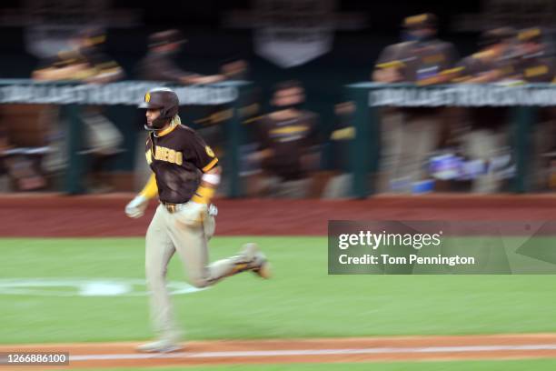 Fernando Tatis Jr. #23 of the San Diego Padres rounds the bases after hitting a three-run home run against the Texas Rangers in the top of the...