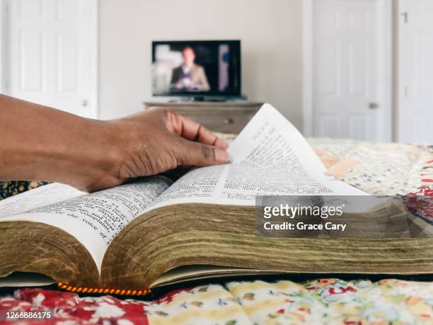 woman reads bible - roman god stock-fotos und bilder