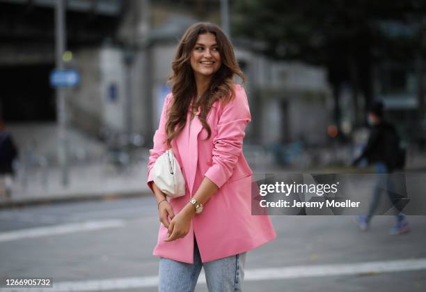 Alicija Laureen wearing pink Guess blazer, blue Nakd jeans, H&M top on August 17, 2020 in Hamburg, Germany.