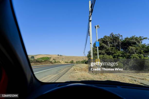 car stopped at a road call box - emergency telephone box stock pictures, royalty-free photos & images