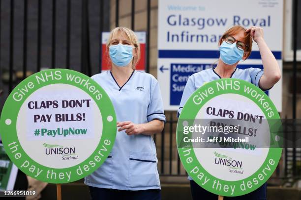 Nurses stage a protest outside Glasgow Royal Infirmary after being left out of a public sector pay rise on August 18, 2020 in Glasgow, United...