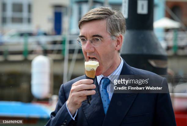 For North East Somerset, Jacob Rees-Mogg eats an ice-cream from Boho Gelato ice cream parlour at the harbourside on August 18, 2020 in Weymouth,...