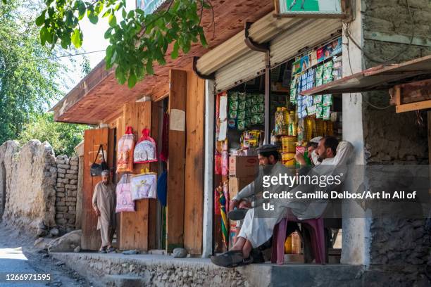 Shopkeeper in front of his grocery store on Mai 17, 2016 in Ayun, Khyber Pakhtunkhwa, Pakistan.