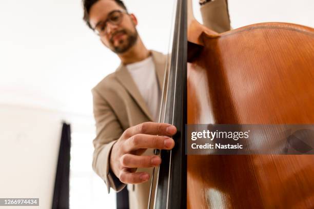 musician playing contrabass - double bass player stock pictures, royalty-free photos & images
