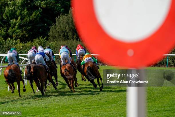 General view as runners turn into the back straight in The Follow At The Races On Twitter Handicap Hurdle at Fontwell Park Racecourse on August 18,...