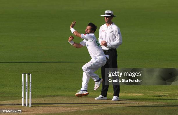 Yasir Shah of Pakistan in bowling action watched by umpire Michael Gough during Day Five of the 2nd #RaiseTheBat Test Match between England and...