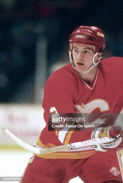 Al MacInnis of the Calgary Flames skates against the New Jersey Devils during an NHL Hockey game circa 1991 at the Brendan Byrne Arena in East...