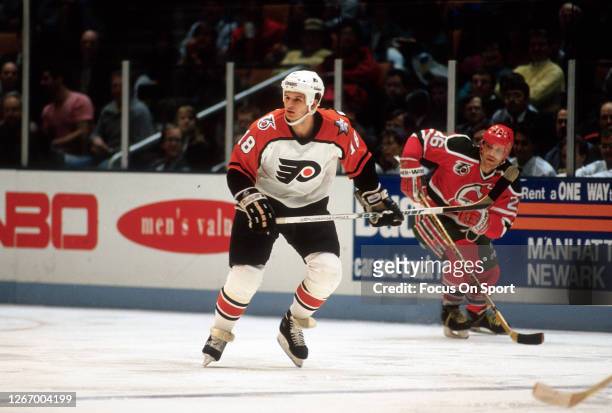 Mike Ricci of the Philadelphia Flyers skates against the New Jersey Devils during an NHL Hockey game circa 1991 at the Brendan Byrne Arena in East...
