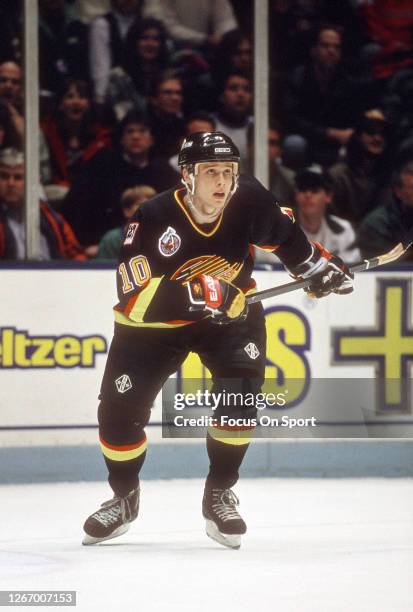 Pavel Bure of the Vancouver Canucks skates against the New Jersey Devils during an NHL Hockey game circa 1993 at the Brendan Byrne Arena in East...